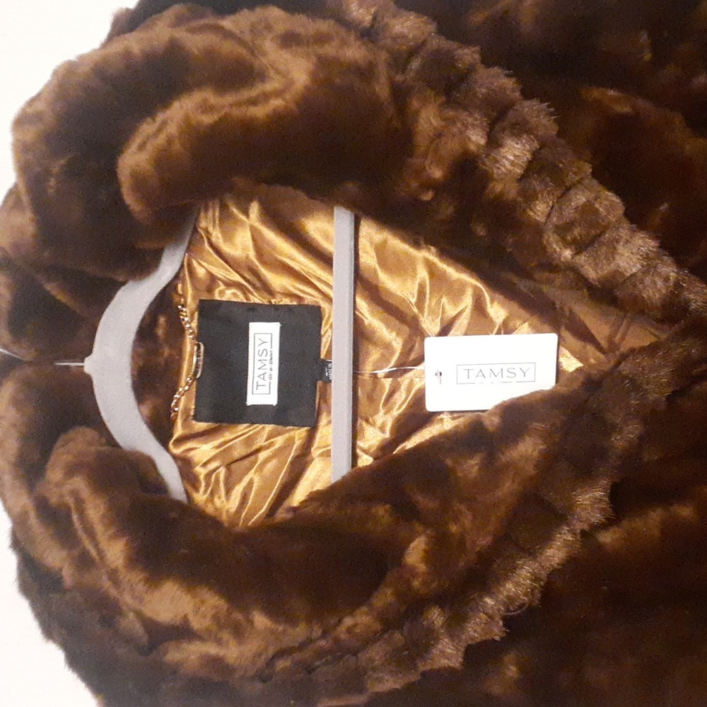 Stunning  Brand New chocolate brown faux fur coat with hood. XL.